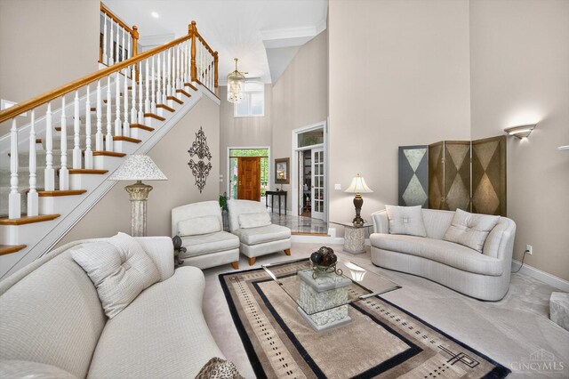 8069 Green Lake Dr, Liberty Twp, OH 45044 - living room with a towering ceiling, stairway, and french doors
