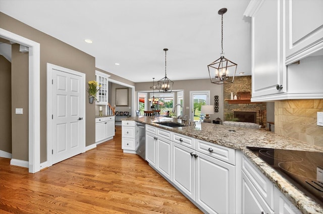 8069 Green Lake Dr, Liberty Twp, OH 45044 - kitchen featuring black electric stovetop, dishwasher, a chandelier, white cabinetry, and recessed lighting