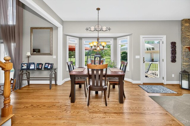 8069 Green Lake Dr, Liberty Twp, OH 45044 - dining area with a chandelier and light wood-style floors