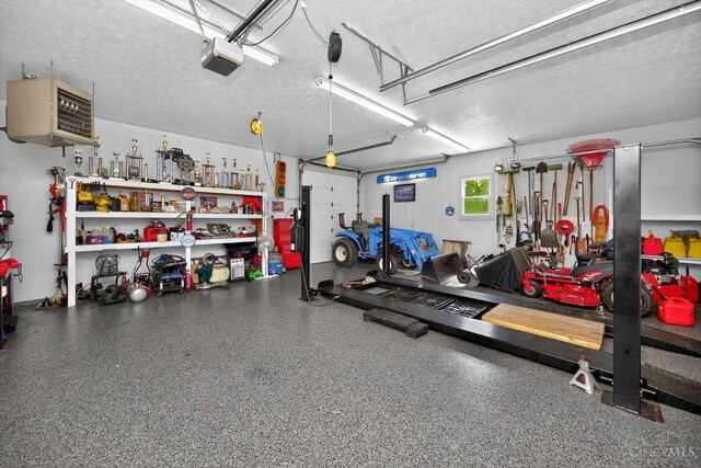 8069 Green Lake Dr, Liberty Twp, OH 45044 - garage with a heating unit, a workshop area, and a garage door opener