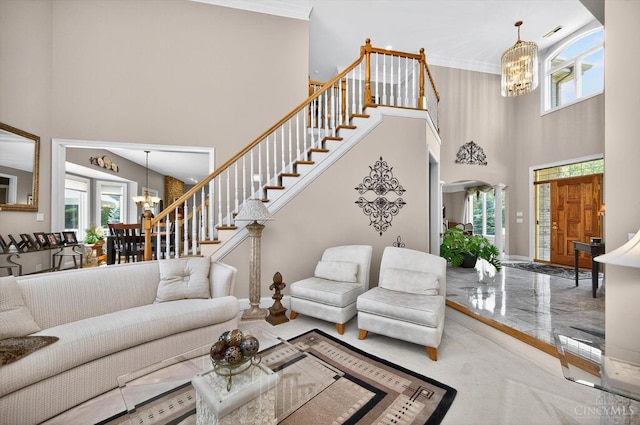 8069 Green Lake Dr, Liberty Twp, OH 45044 - carpeted living area featuring a chandelier, a high ceiling, healthy amount of natural light, and stairway