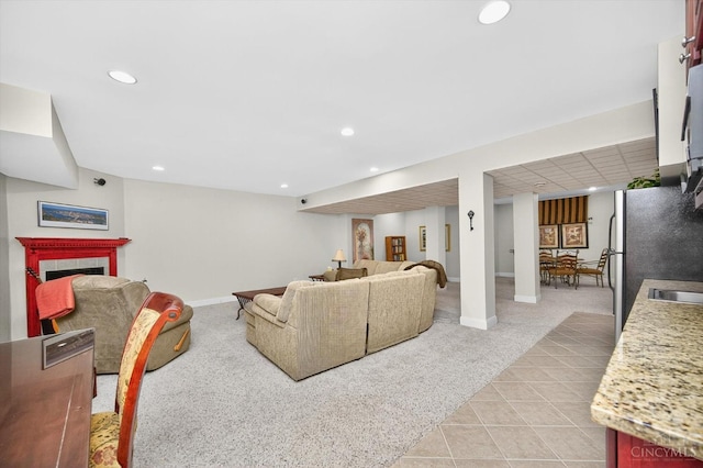 8069 Green Lake Dr, Liberty Twp, OH 45044 - living area featuring light carpet, recessed lighting, a tile fireplace, and light tile patterned floors