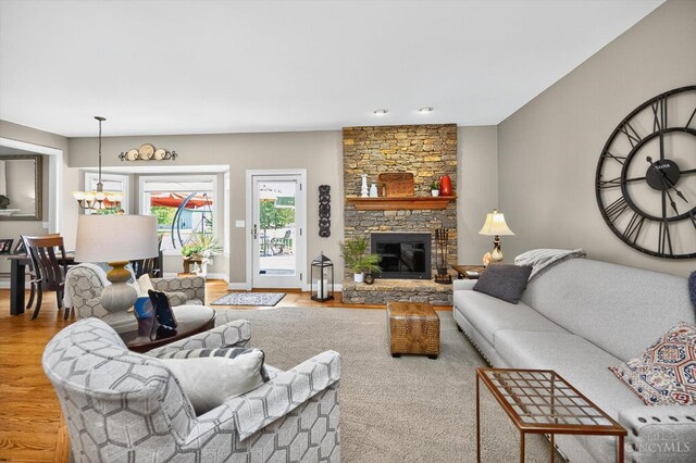 8069 Green Lake Dr, Liberty Twp, OH 45044 - living room featuring wood finished floors and a stone fireplace