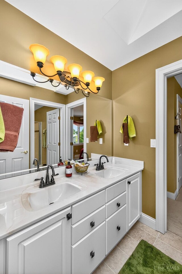 8069 Green Lake Dr, Liberty Twp, OH 45044 - full bathroom with double vanity and tile patterned floors