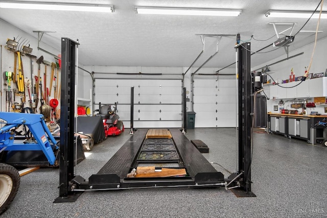 8069 Green Lake Dr, Liberty Twp, OH 45044 - garage with a workshop area and a garage door opener