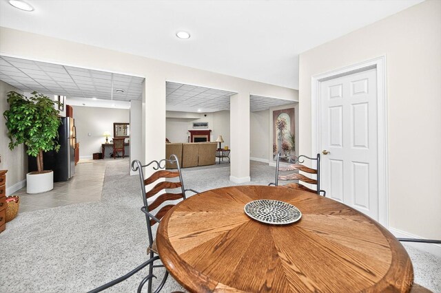 8069 Green Lake Dr, Liberty Twp, OH 45044 - dining area with recessed lighting, light tile patterned floors, and a fireplace