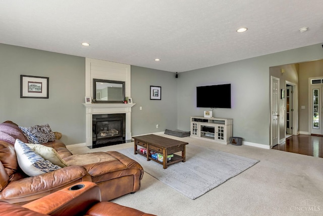 1820 Meadow Sweet Dr, Turtle Creek Twp, OH 45036 - living area featuring a fireplace, recessed lighting, and carpet