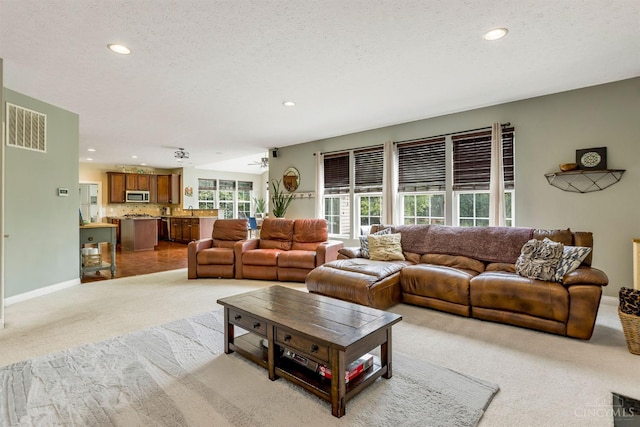 1820 Meadow Sweet Dr, Turtle Creek Twp, OH 45036 - carpeted living area featuring recessed lighting and a textured ceiling