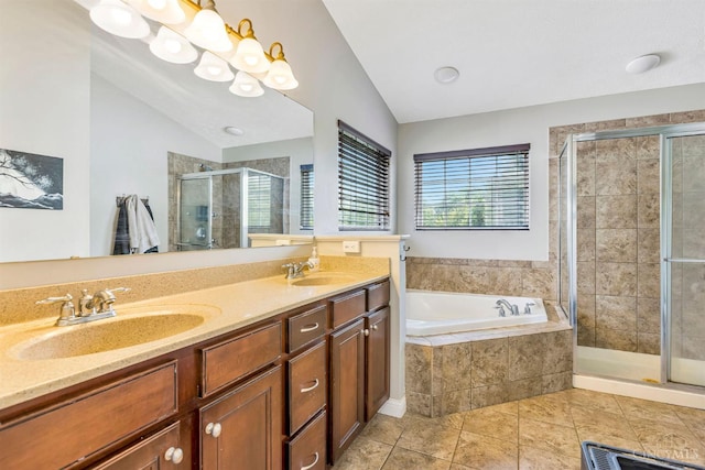 1820 Meadow Sweet Dr, Turtle Creek Twp, OH 45036 - full bath featuring vaulted ceiling, a shower stall, a bath, double vanity, and tile patterned floors