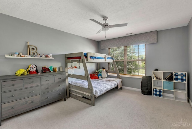 1820 Meadow Sweet Dr, Turtle Creek Twp, OH 45036 - bedroom featuring carpet flooring, a textured ceiling, and a ceiling fan