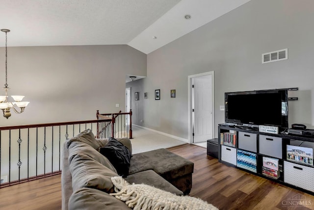 1820 Meadow Sweet Dr, Turtle Creek Twp, OH 45036 - living area featuring a chandelier, high vaulted ceiling, and wood finished floors