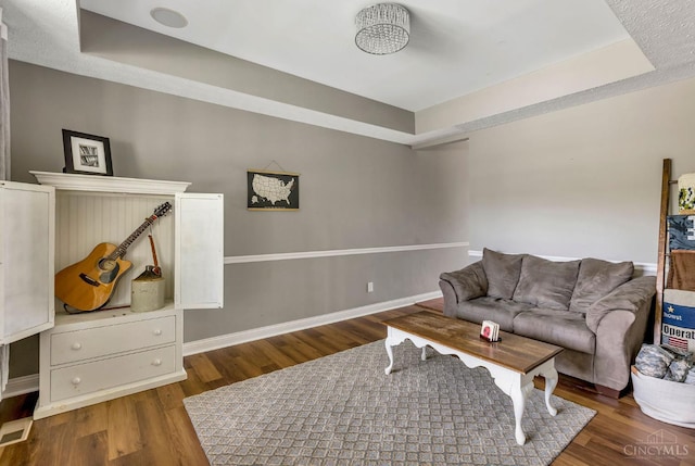 1820 Meadow Sweet Dr, Turtle Creek Twp, OH 45036 - living room with a tray ceiling and wood finished floors
