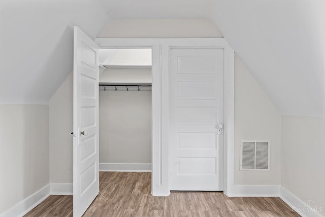4150 Paddock Rd, Cincinnati, OH 45229 - additional living space with vaulted ceiling and wood finished floors