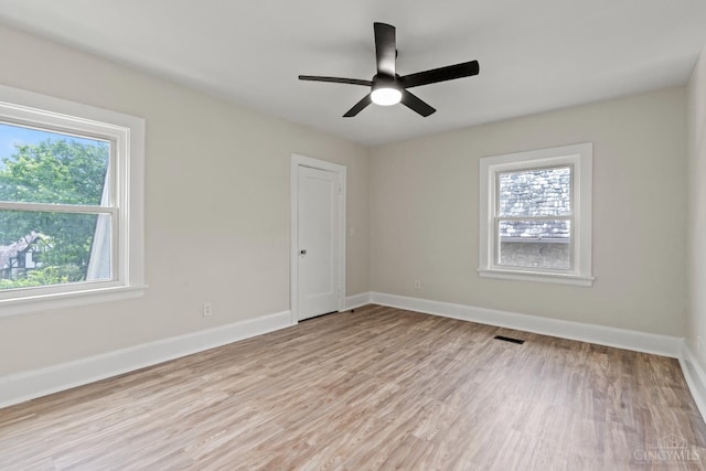 4150 Paddock Rd, Cincinnati, OH 45229 - unfurnished room featuring healthy amount of natural light, light wood finished floors, and a ceiling fan