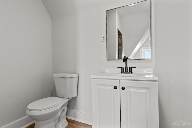 4150 Paddock Rd, Cincinnati, OH 45229 - half bathroom featuring vanity and wood finished floors