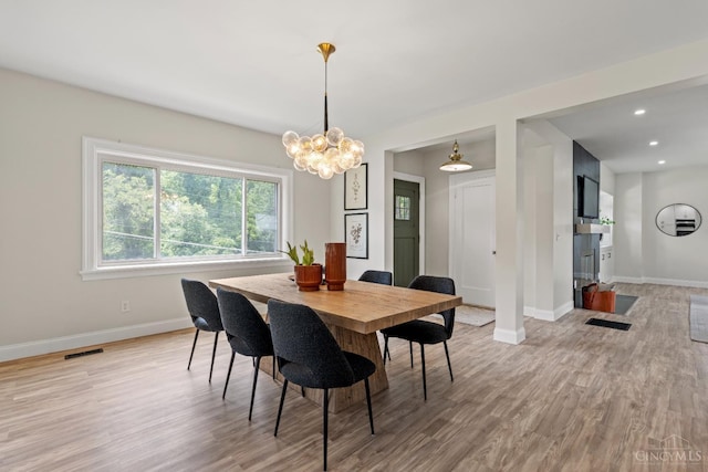 4150 Paddock Rd, Cincinnati, OH 45229 - dining area featuring a chandelier, light wood-style flooring, and recessed lighting