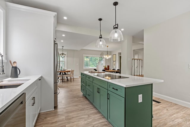 4150 Paddock Rd, Cincinnati, OH 45229 - kitchen featuring green cabinets, stainless steel appliances, light wood-style flooring, recessed lighting, and light countertops