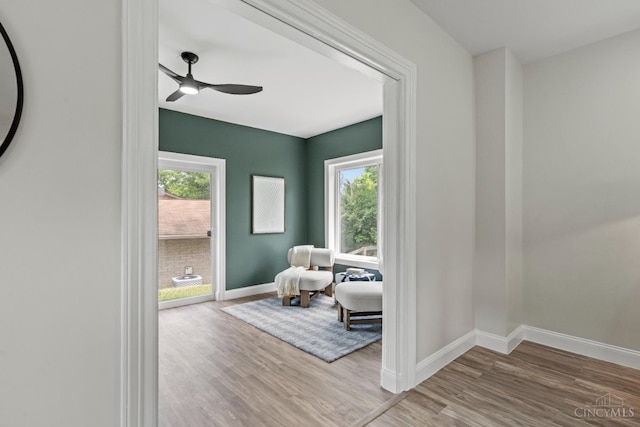 4150 Paddock Rd, Cincinnati, OH 45229 - sitting room featuring wood finished floors, healthy amount of natural light, and a ceiling fan