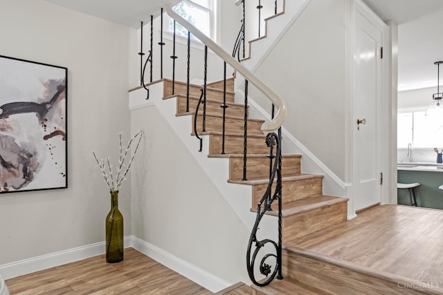 4150 Paddock Rd, Cincinnati, OH 45229 - stairway featuring wood finished floors and baseboards