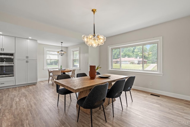 4150 Paddock Rd, Cincinnati, OH 45229 - dining space with a chandelier, light wood-style floors, and recessed lighting