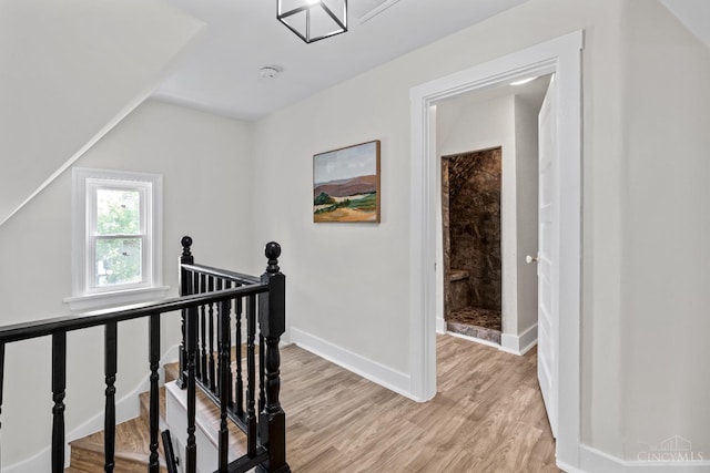 4150 Paddock Rd, Cincinnati, OH 45229 - hallway with an upstairs landing and light wood-style flooring