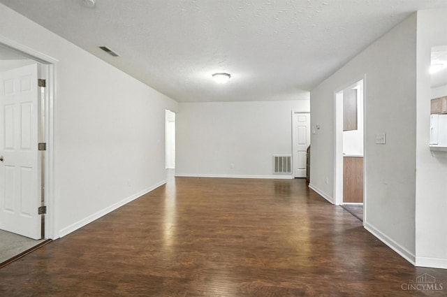 5433 Harbourwatch Unit 104, Deerfield Twp, OH 45040 - spare room featuring dark wood finished floors and a textured ceiling