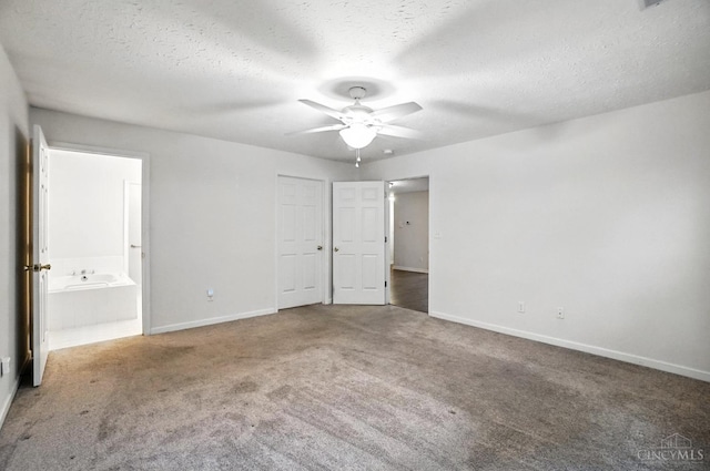 5433 Harbourwatch Unit 104, Deerfield Twp, OH 45040 - unfurnished bedroom with carpet flooring, a textured ceiling, ensuite bath, and ceiling fan