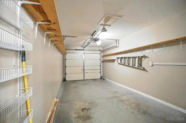 5433 Harbourwatch Unit 104, Deerfield Twp, OH 45040 - garage featuring baseboards and a garage door opener