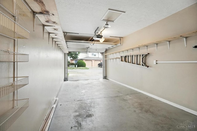 5433 Harbourwatch Unit 104, Deerfield Twp, OH 45040 - garage with a baseboard radiator and a garage door opener