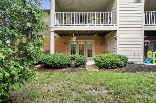 5433 Harbourwatch Unit 104, Deerfield Twp, OH 45040 - property entrance featuring a balcony and brick siding