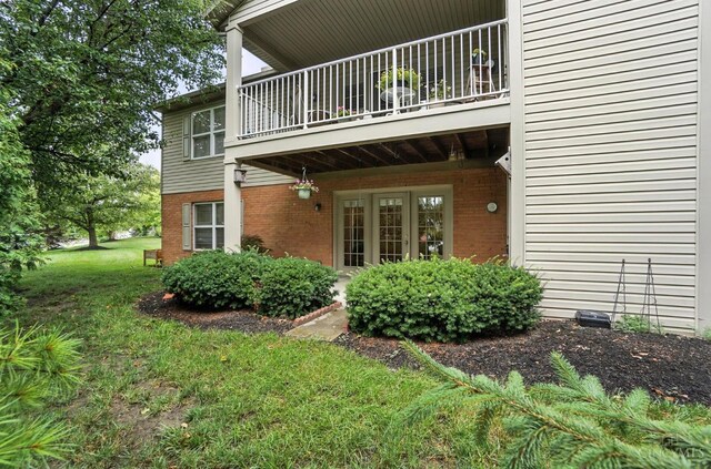 5433 Harbourwatch Unit 104, Deerfield Twp, OH 45040 - view of side of home with brick siding and a yard