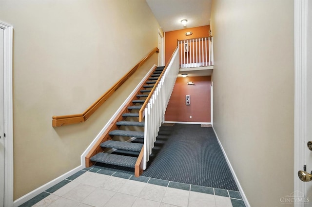 5433 Harbourwatch Unit 104, Deerfield Twp, OH 45040 - staircase featuring tile patterned floors and carpet flooring