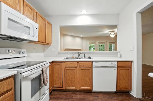 5433 Harbourwatch Unit 104, Deerfield Twp, OH 45040 - kitchen with white appliances, dark wood-type flooring, light countertops, a ceiling fan, and recessed lighting