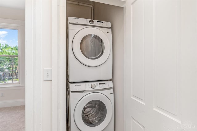 1419 Chase Ave, Cincinnati, OH 45223 - laundry room with estacked washer and dryer and carpet flooring
