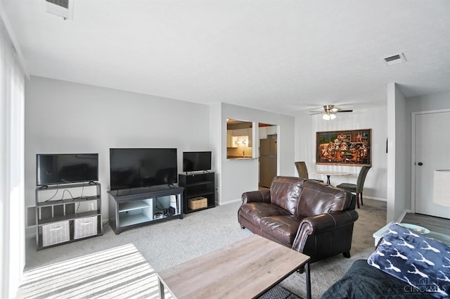 7234 Creekview Dr Unit 1, Colerain Twp, OH 45247 - carpeted living area with a ceiling fan and baseboards