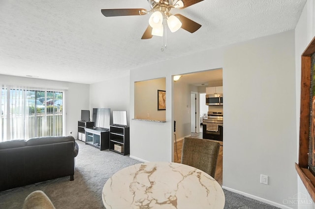 7234 Creekview Dr Unit 1, Colerain Twp, OH 45247 - carpeted living room featuring a textured ceiling and ceiling fan