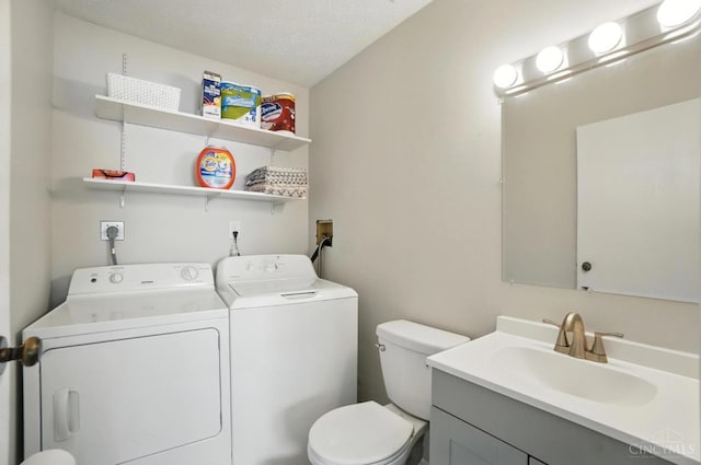7234 Creekview Dr Unit 1, Colerain Twp, OH 45247 - half bath featuring washer and dryer, vanity, and a textured ceiling