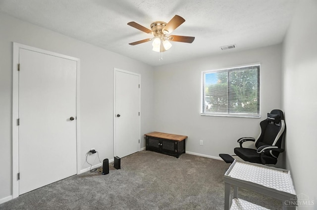 7234 Creekview Dr Unit 1, Colerain Twp, OH 45247 - sitting room with carpet floors, ceiling fan, and a textured ceiling