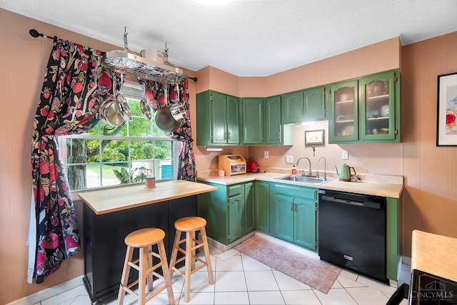 1146 Wilshire Ave, Anderson Twp, OH 45230 - kitchen featuring black dishwasher, green cabinetry, light countertops, and glass insert cabinets