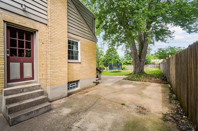 1146 Wilshire Ave, Anderson Twp, OH 45230 - view of patio / terrace with a trampoline and entry steps
