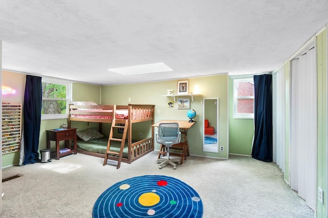 1146 Wilshire Ave, Anderson Twp, OH 45230 - carpeted bedroom with a skylight and a textured ceiling