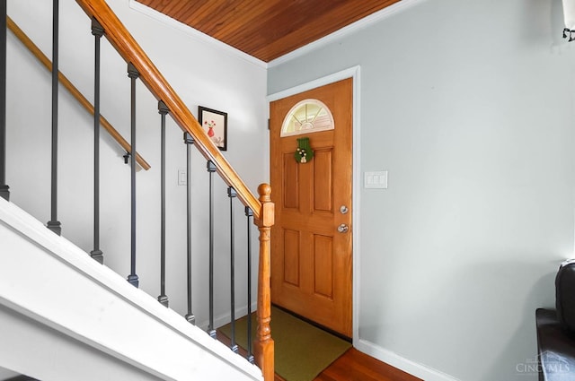 1146 Wilshire Ave, Anderson Twp, OH 45230 - foyer entrance with crown molding, wooden ceiling, dark wood-type flooring, and stairs