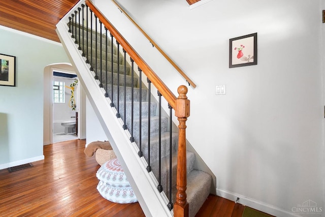 1146 Wilshire Ave, Anderson Twp, OH 45230 - stairway with arched walkways and wood-type flooring