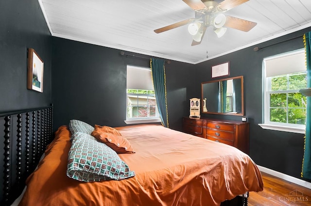 1146 Wilshire Ave, Anderson Twp, OH 45230 - bedroom with wood finished floors, ceiling fan, and crown molding