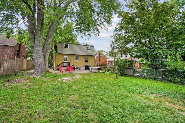 1146 Wilshire Ave, Anderson Twp, OH 45230 - rear view of property featuring a patio area and a fenced backyard