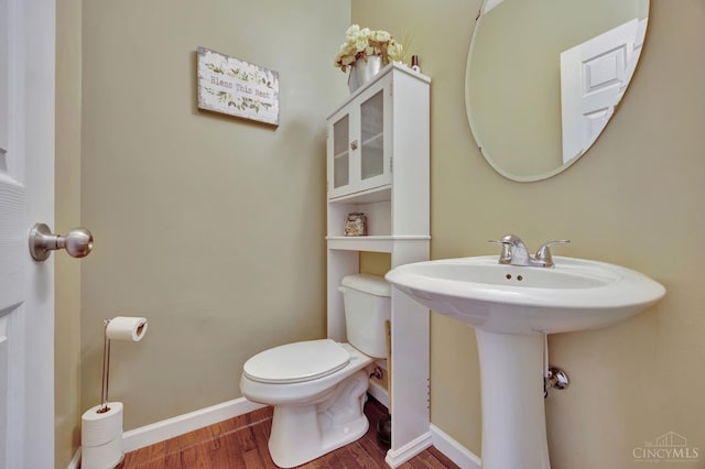 8020 Stoney Ridge Dr, Colerain Twp, OH 45247 - half bath with wood finished floors and toilet