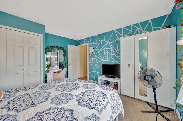 8020 Stoney Ridge Dr, Colerain Twp, OH 45247 - carpeted bedroom with a closet, wallpapered walls, and an accent wall