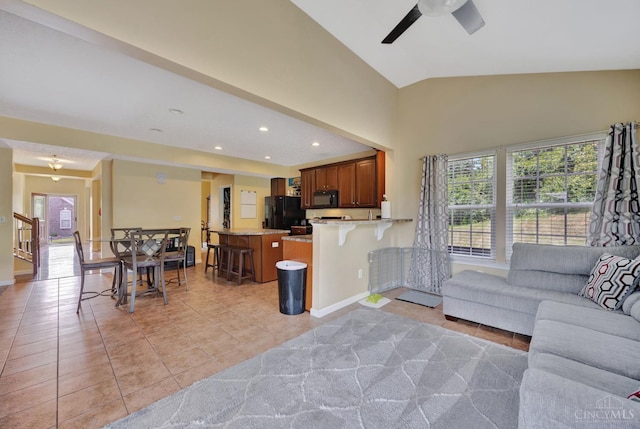 8020 Stoney Ridge Dr, Colerain Twp, OH 45247 - living room featuring healthy amount of natural light, light tile patterned floors, ceiling fan, vaulted ceiling, and recessed lighting