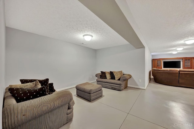 8020 Stoney Ridge Dr, Colerain Twp, OH 45247 - living area with a textured ceiling and finished concrete floors