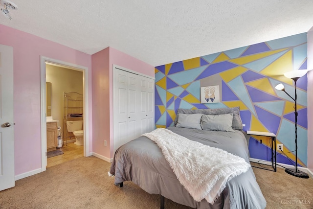 8020 Stoney Ridge Dr, Colerain Twp, OH 45247 - carpeted bedroom with an accent wall, a closet, a textured ceiling, ensuite bathroom, and wallpapered walls
